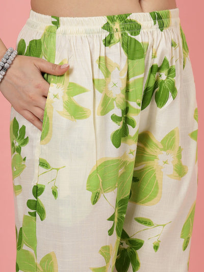 Floral printed trousers with green and white design, elastic waistband, and slip-on closure.