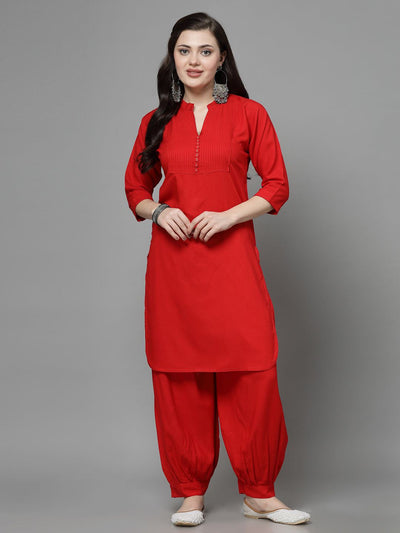Yoke design red kurta with Afghani pants, three-quarter sleeves, and mandarin collar.