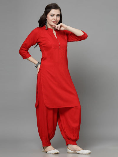 Yoke design kurta with Afghani pants in red, featuring three-quarter sleeves and mandarin collar.