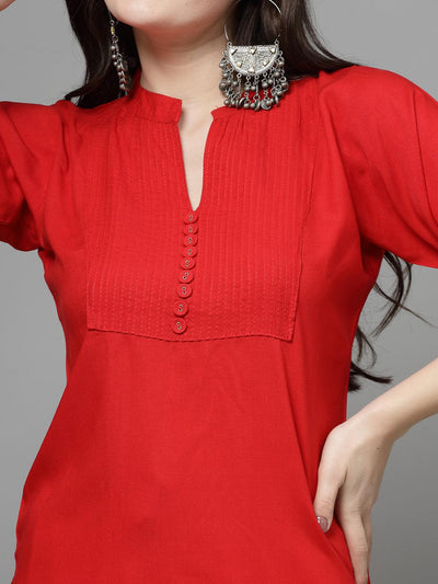 Yoke design red kurta with mandarin collar and three-quarter sleeves.