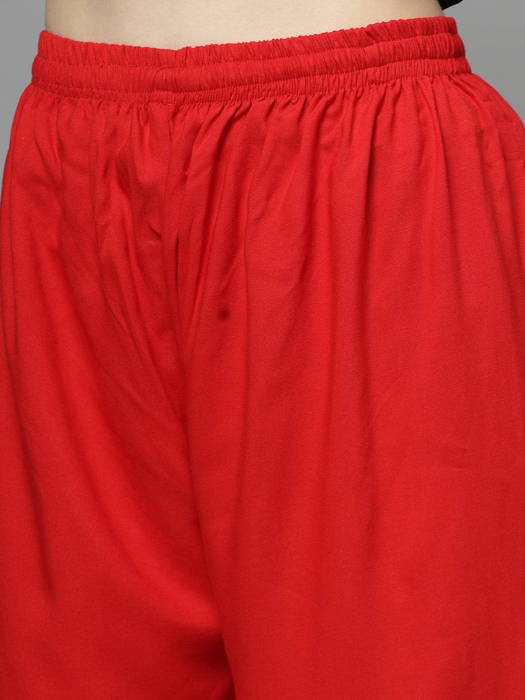 Yoke design kurta with Afghani pants in vibrant red, featuring mandarin collar and three-quarter sleeves.