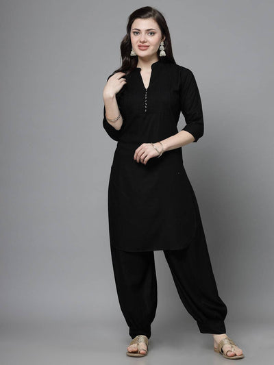 Yoke design kurta with Afghani pants in black, featuring a mandarin collar, three-quarter sleeves, and cuffed hem pants.