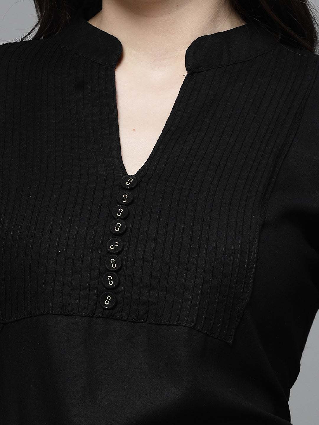Black yoke design kurta with mandarin collar and button details.
