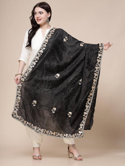 Black embellished silk blend dupatta with intricate gotta patti work, draped elegantly.