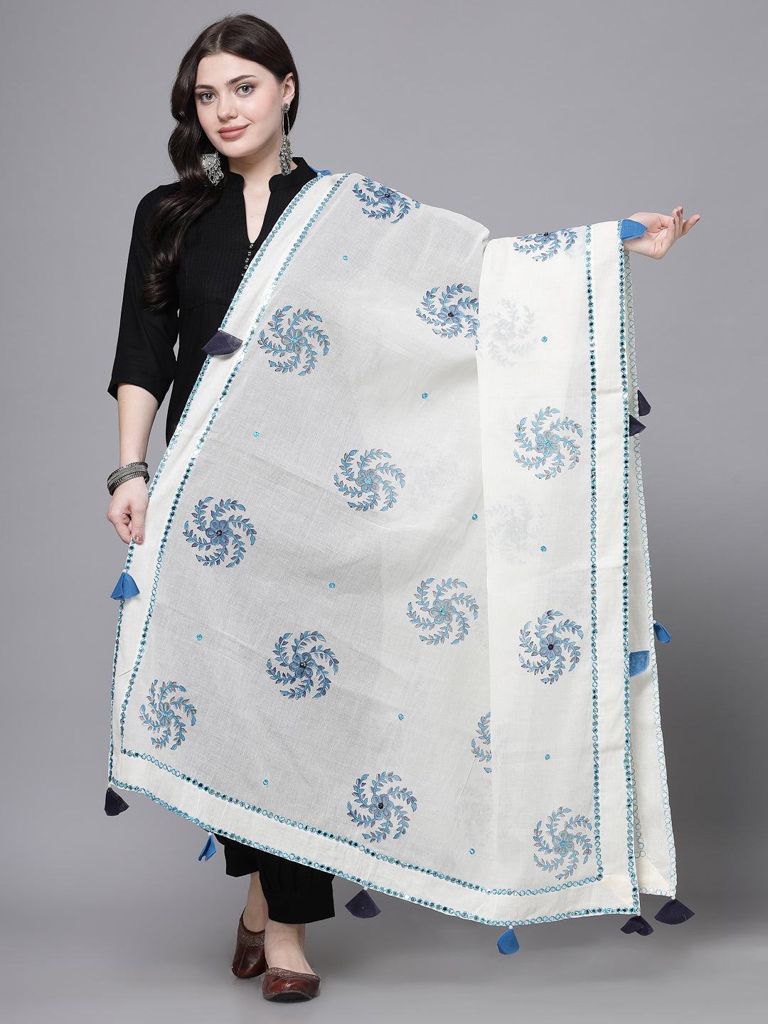 Turquoise Blue Mirror Work Cotton Dupatta with Tasseled Border displayed by model.