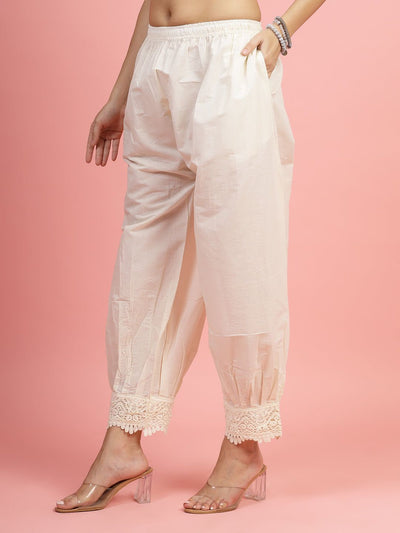 White cotton loose fit Afghani salwar with lace detailing, perfect for casual and semi-formal wear.