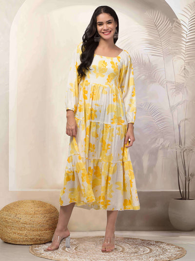 Women yellow printed fit & flare dress with floral design in viscose rayon fabric.