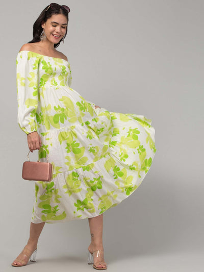 Women parrot green printed fit & flare dress in viscose rayon fabric.
