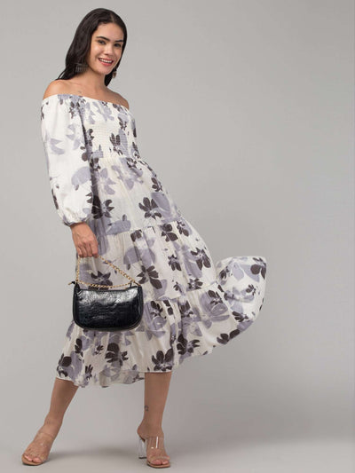Women wearing a black printed fit and flare dress, made from viscose rayon, perfect for casual and semi-formal occasions.