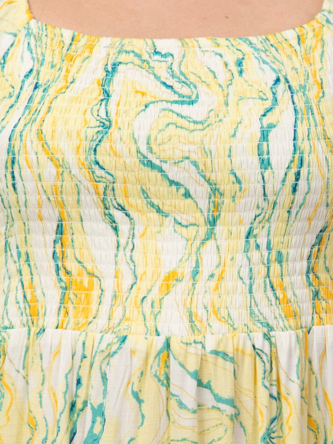 Women yellow printed fit & flare dress with artistic design on viscose rayon fabric.