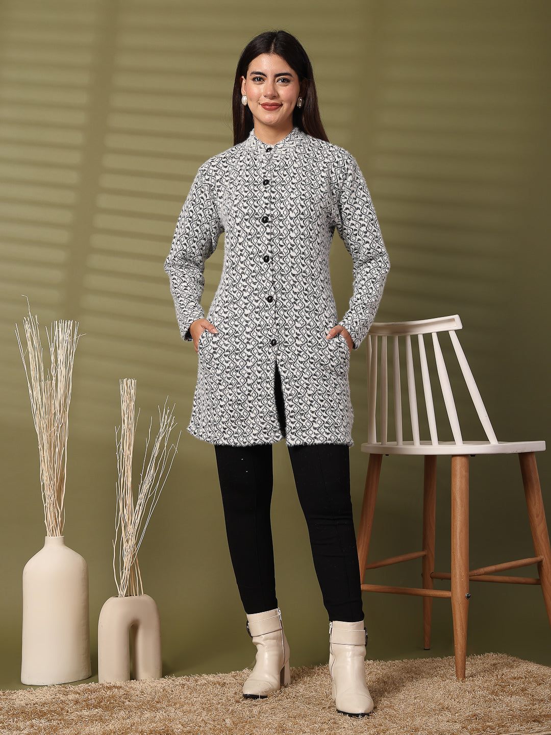 Black woolen knitted cardigan with full sleeves and open-front design.