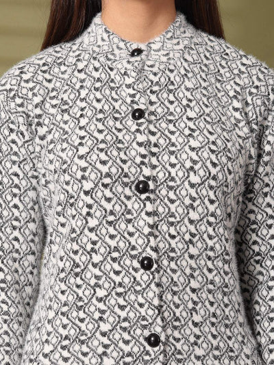 Black woolen knitted cardigan with full sleeves and button detailing.