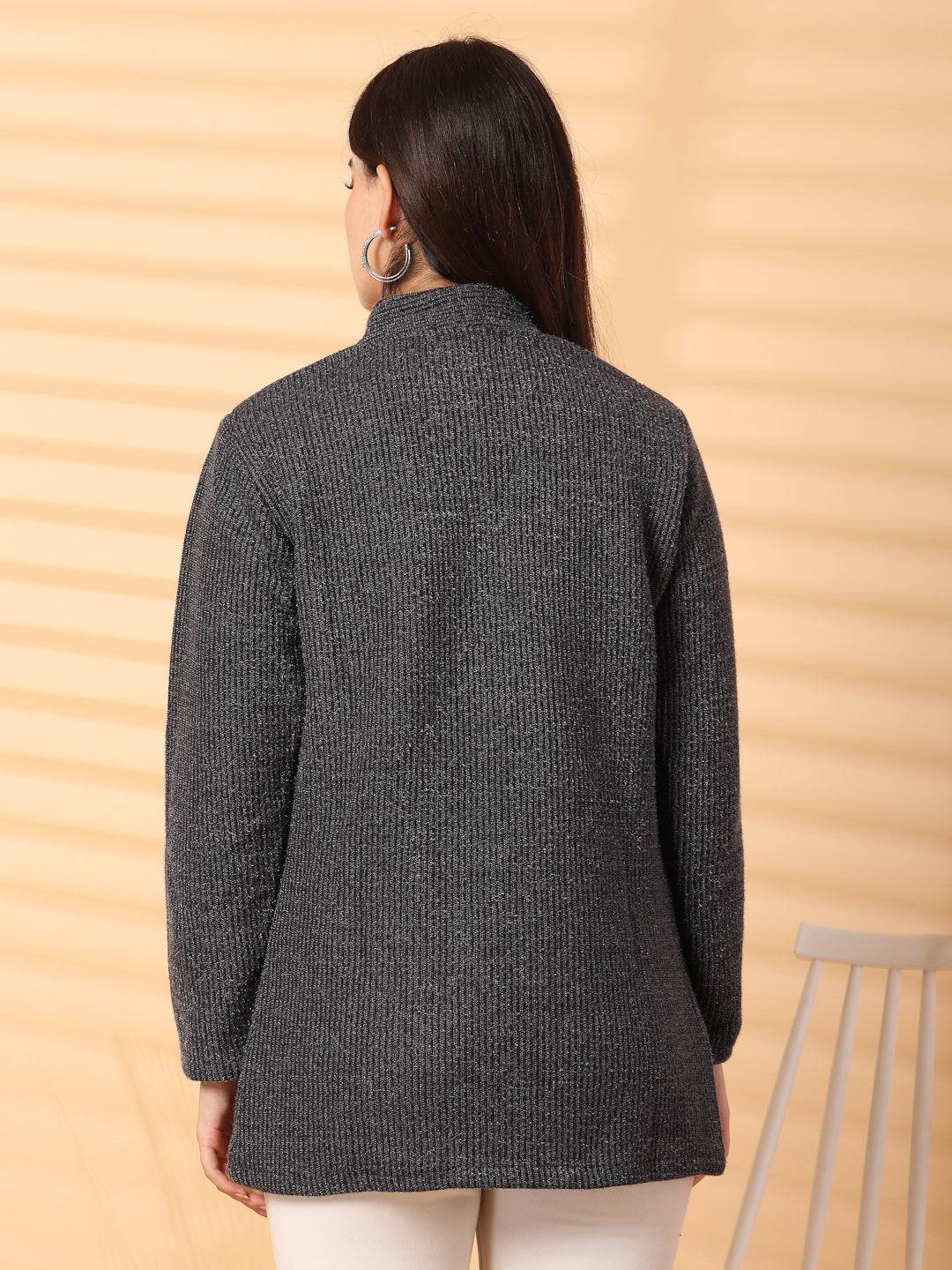 Back view of black woolen knitted cardigan with full sleeves and open-front design.