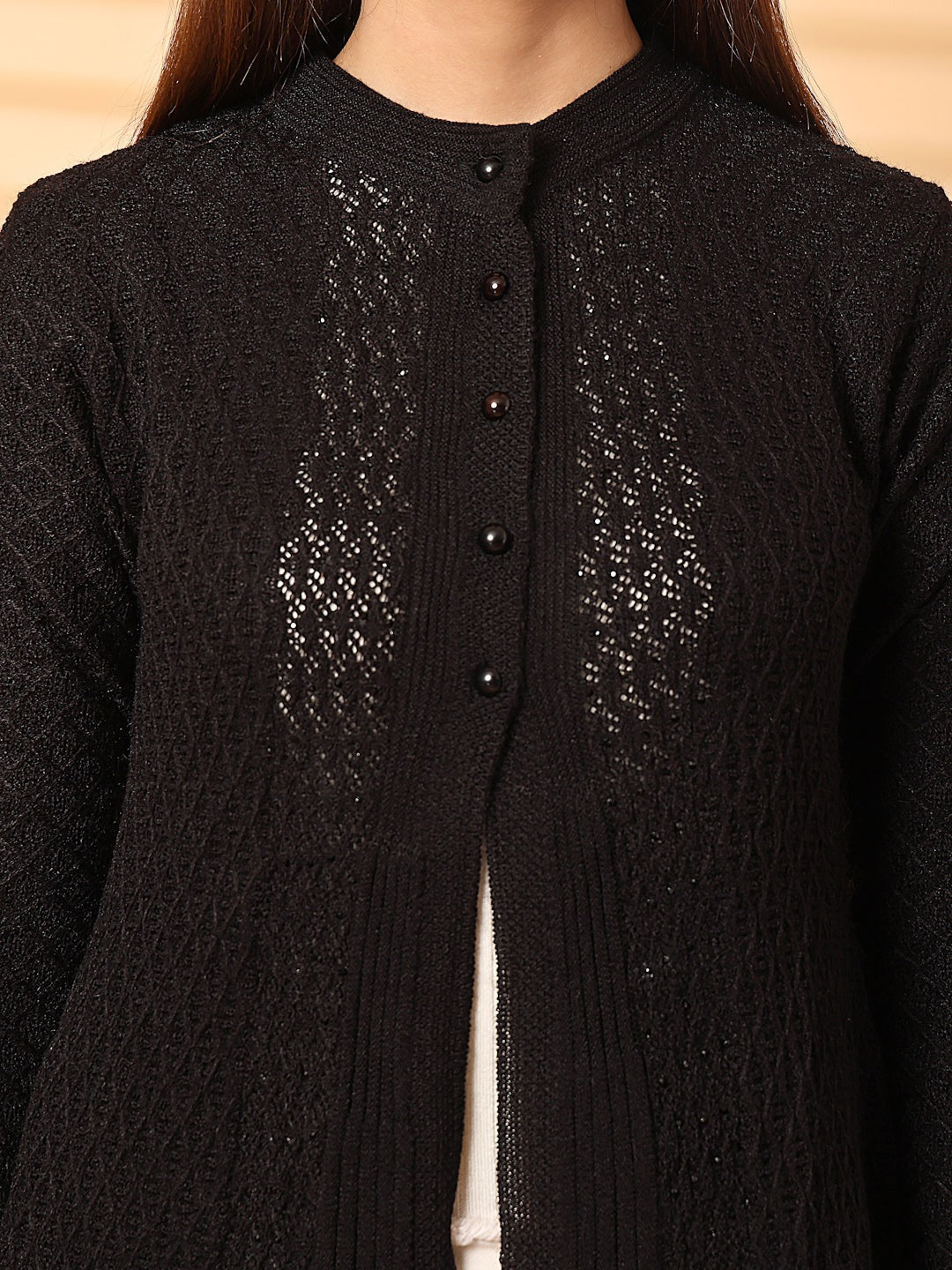 Black embellished longline woolen cardigan with full sleeves and elegant design.