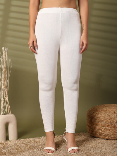 Women white solid woolen leggings with chic hem design.