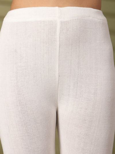 Women white solid woolen leggings with chic hem design.