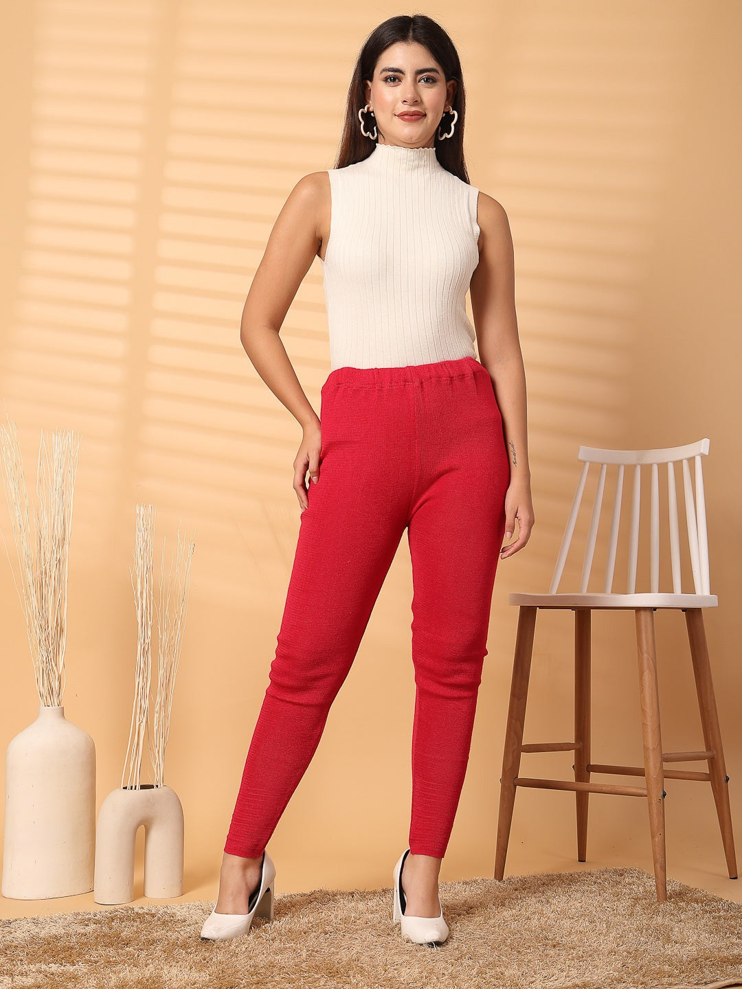 Women magenta solid woolen leggings with unique hem design for stylish warmth and comfort.