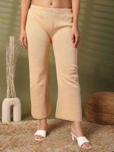 Fawn woolen palazzo with intricate cut work detailing along the hemline.