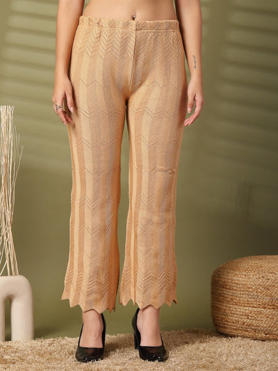 Fawn solid cut work woolen palazzo with intricate hem detailing.