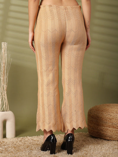 Fawn solid cut work woolen palazzo with intricate hem detailing.