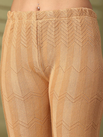 Fawn solid cut work woolen palazzo with intricate hem detailing.