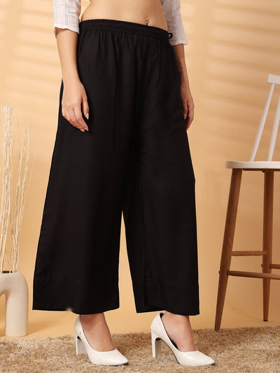 Black solid rayon straight palazzo with wide leg fit and elasticated waistband.