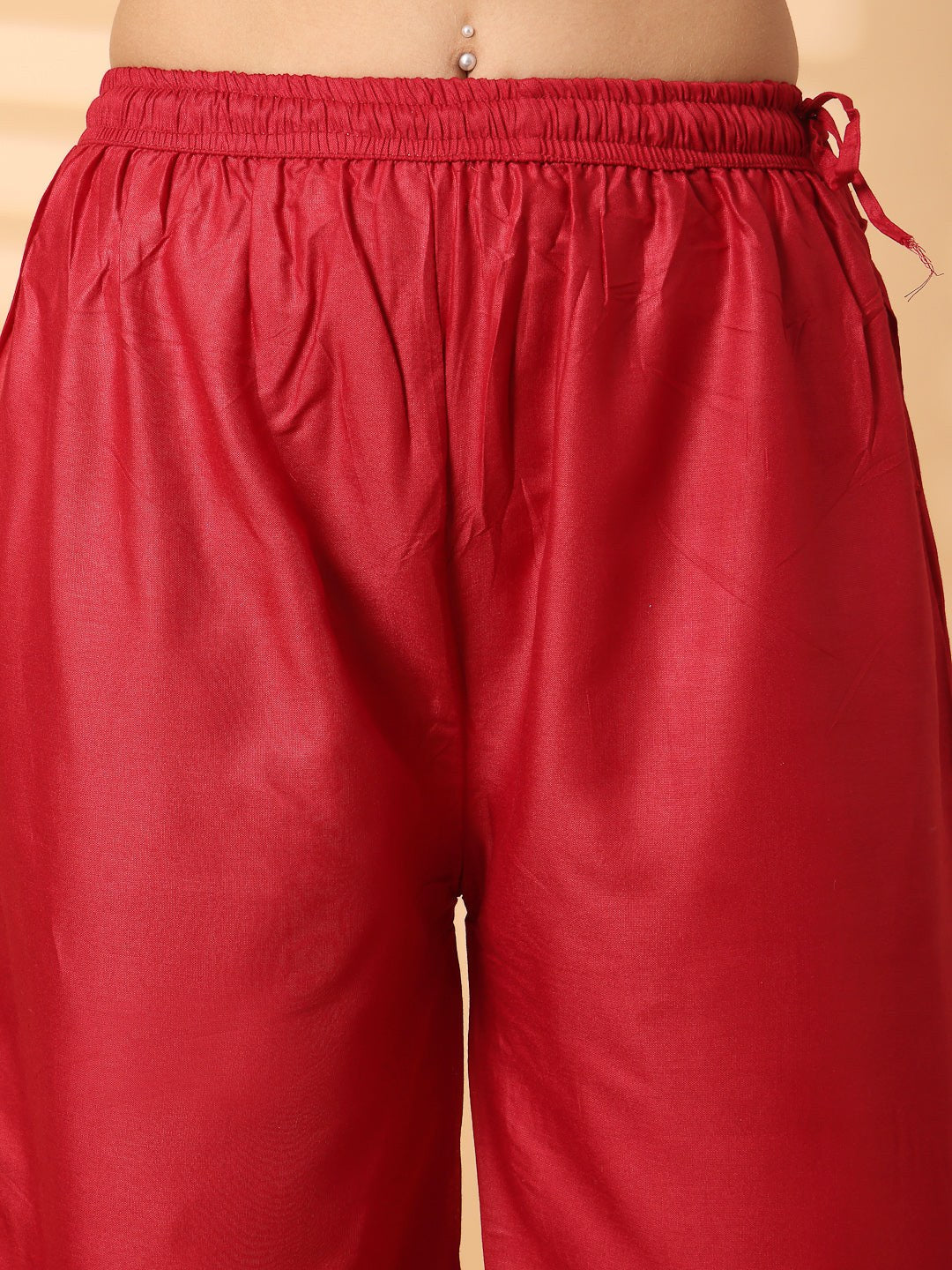 Black solid rayon straight palazzo with elasticated waistband and wide leg fit.