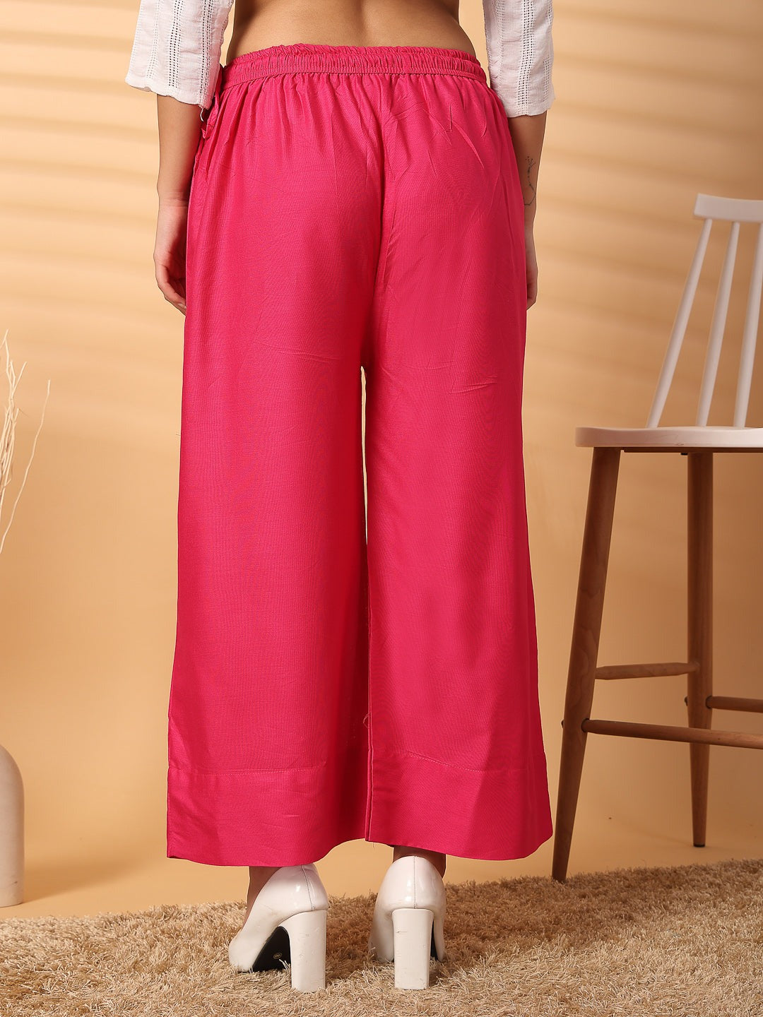 Magenta solid rayon palazzo with wide leg fit and elasticated waistband.