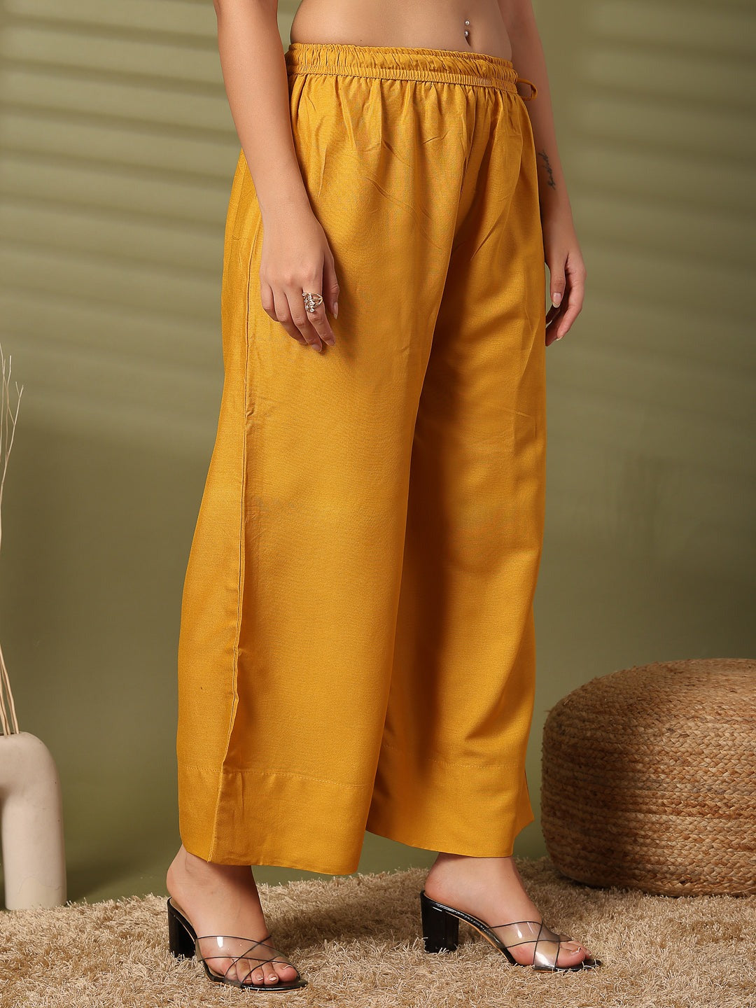 Magenta solid rayon straight palazzo with elasticated waistband and wide leg fit.