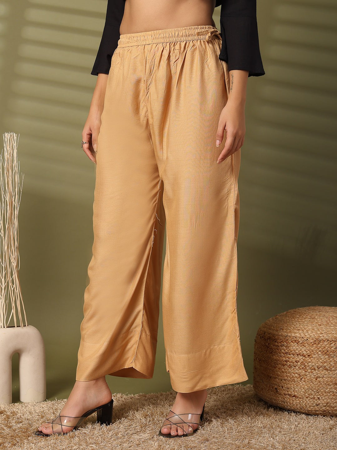 Fawn solid rayon straight palazzo with elasticated waistband and wide leg fit.