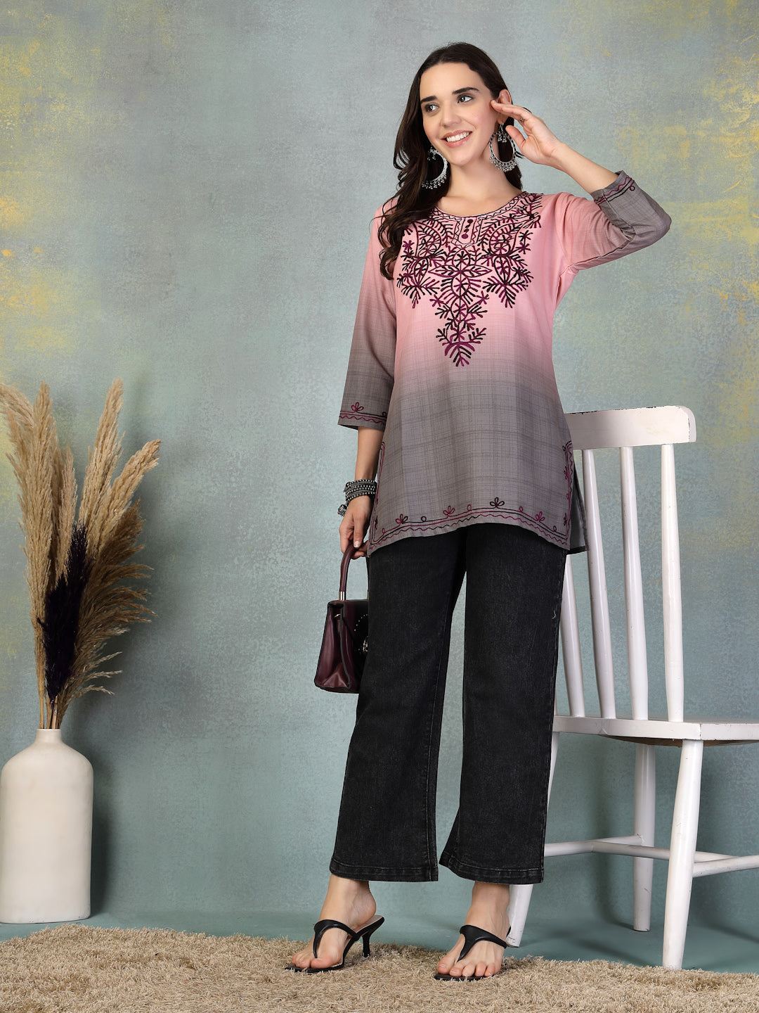 Pink embroidered rayon kurti with intricate design, perfect for casual or festive wear.