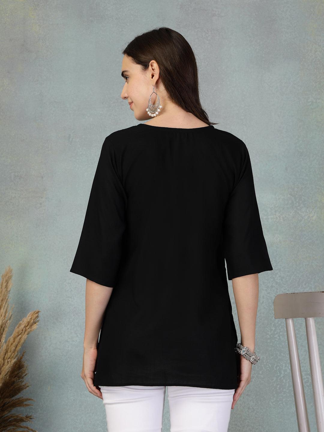 Black embroidered rayon kurti with three-quarter sleeves worn with white pants back view