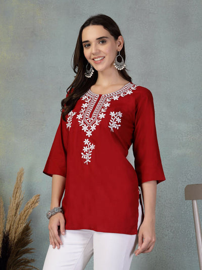 Maroon embroidered rayon kurti with white floral embroidery, worn with white pants
