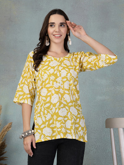 Mustard Kantha work printed cotton kurti with floral design.
