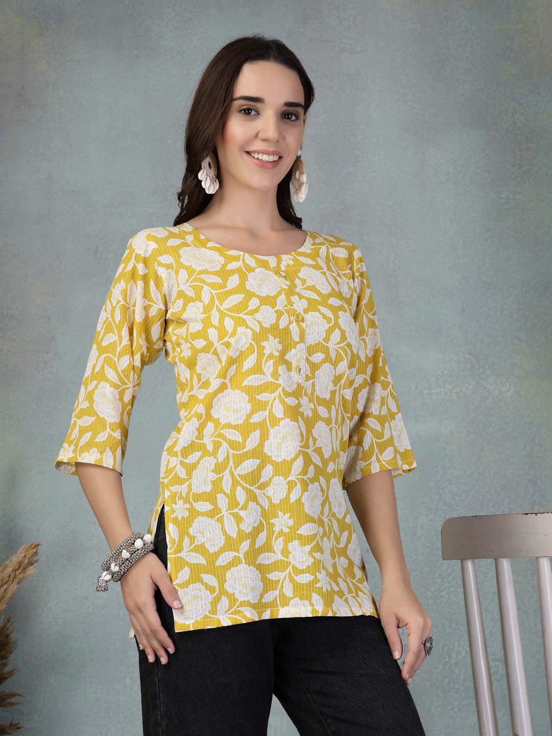 Mustard cotton kurti with Kantha work and floral print.