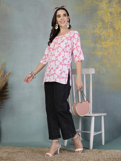 Pink Kantha Work printed cotton kurti with floral design worn with black pants and white heels