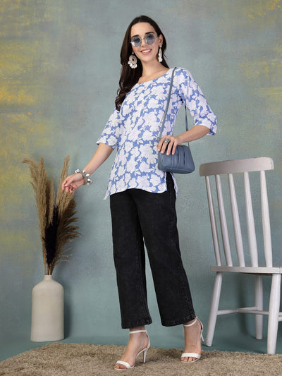 Blue Kantha Work printed cotton kurti with floral embroidery, paired with black pants and white heels