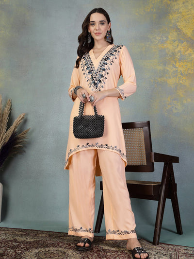 Peach embroidered rayon asymmetric kurta with palazzo set featuring Lucknowi-style embroidery.