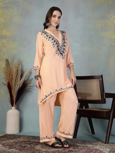 Peach embroidered rayon asymmetrical kurta with palazzo set featuring Lucknowi-style design.