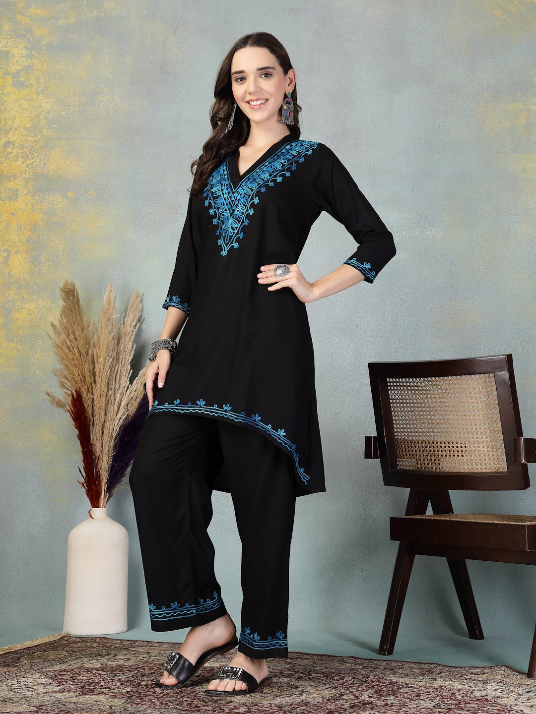 Black embroidered rayon asymmetric co-ord set with Lucknowi-style detailing.