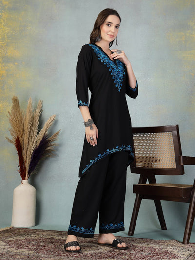Black embroidered rayon asymmetric co-ord set with Lucknowi-style detailing.
