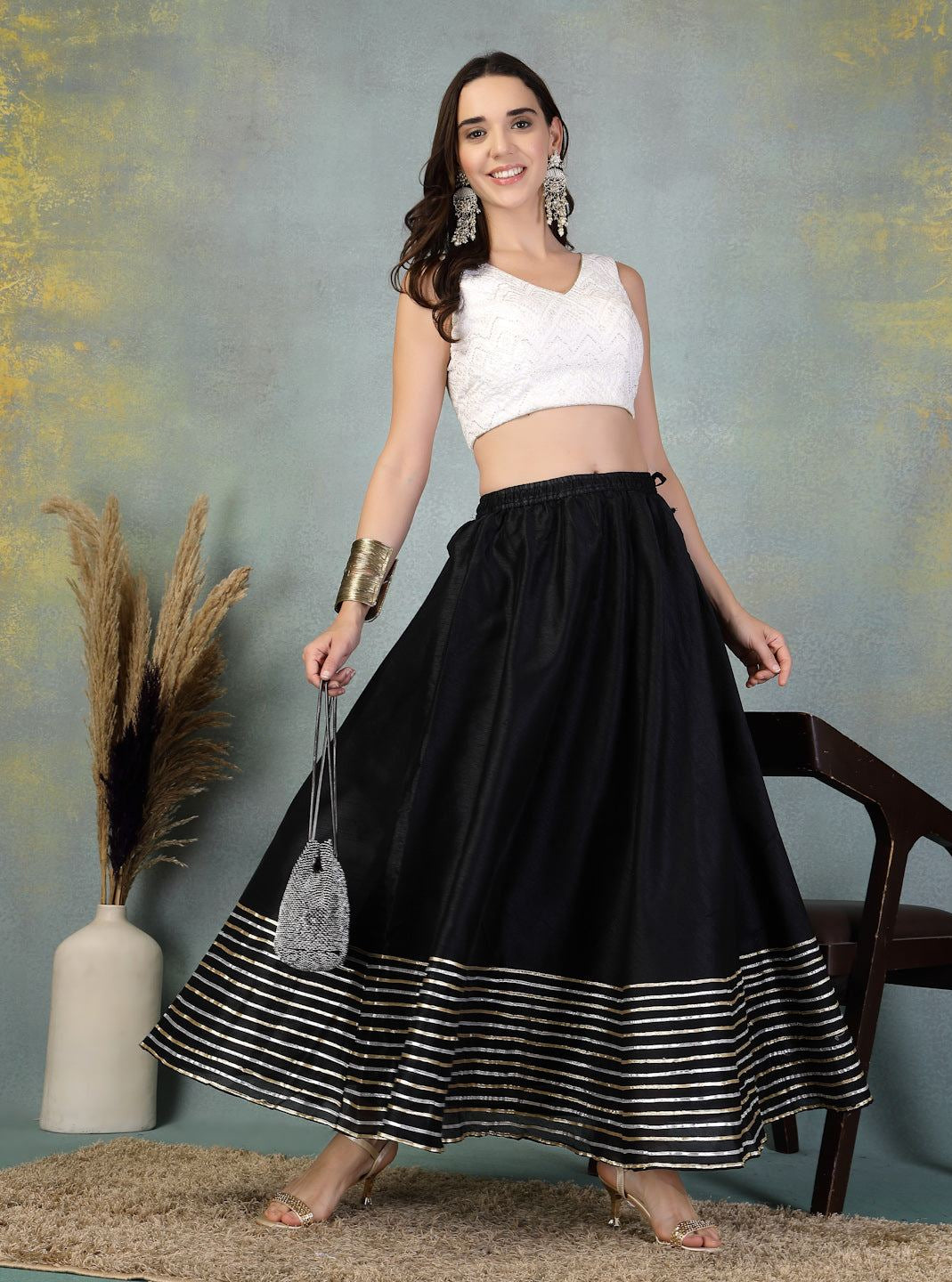 Black Gotta Patti Chanderi silk flared skirt with intricate gold detailing at hem