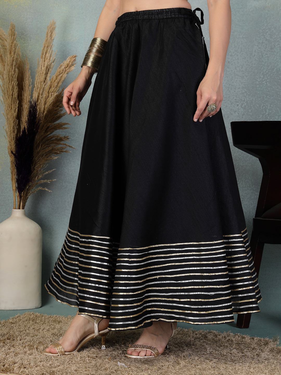 Black Chanderi silk flared skirt with intricate Gota Patti work at the hem