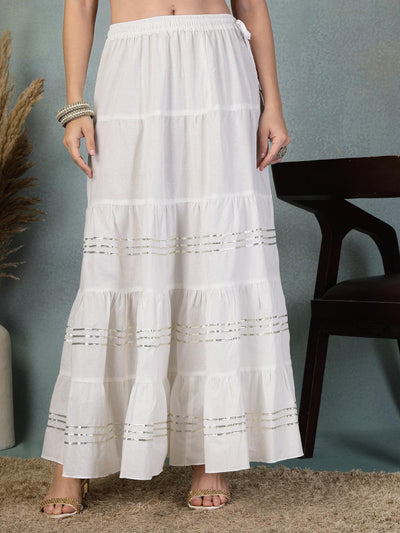 Off-white cotton flared cotton skirt with traditional Gota Patti work for festive and formal wear