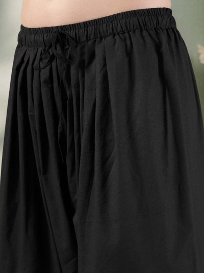Black Solid Thread Work Farshi Salwar with intricate detailing and elegant flow.