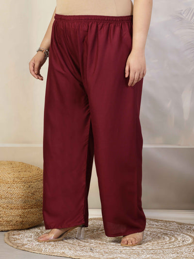 Women solid wine straight rayon palazzo with flared fit and elasticated waistband.