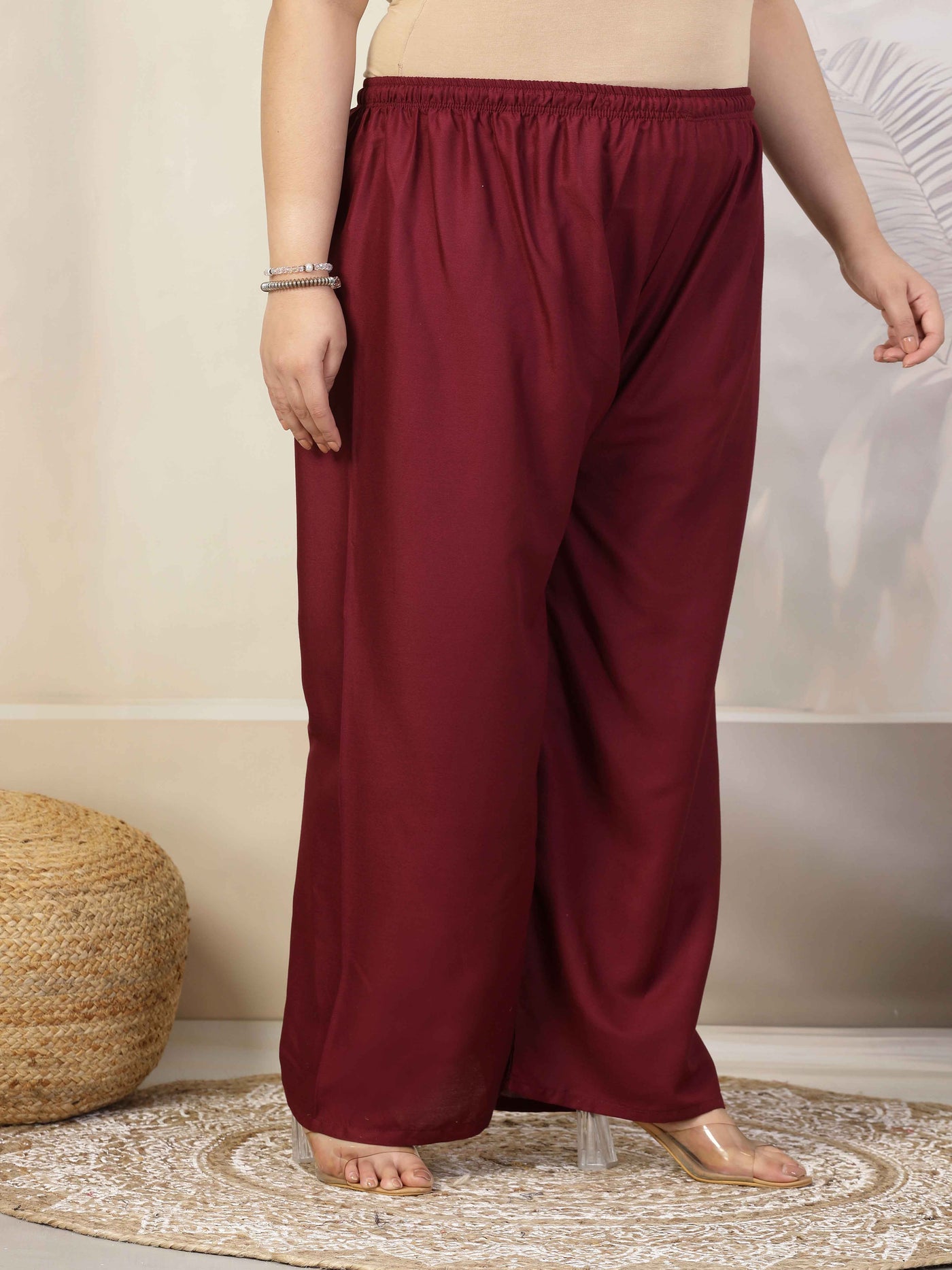 Women solid wine straight rayon palazzo with elasticated waistband and drawstring closure.