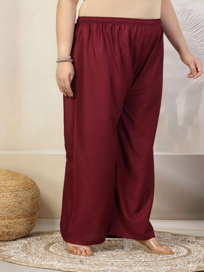 Women solid wine straight rayon palazzo with elasticated waistband and drawstring closure.