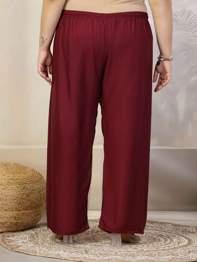 Women solid wine straight rayon palazzo with elasticated waistband.