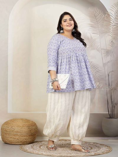 Woman wearing cotton lurex loose fit Afghani salwar with elasticated waistband and drawstring closure.